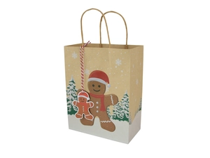 Detail of Christmas gingerbread kraft paper gift bag with matching hang tag and handles