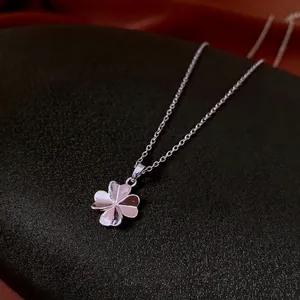 Minimalist silver four-leaf clover pendant necklace with polished finish for women