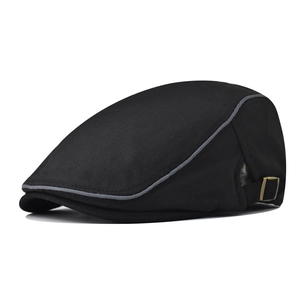 Detail of black cotton flat cap featuring grey piping edges and adjustable bronze buckle