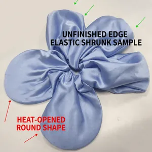 Oversized light blue satin flower scrunchie with a glossy silk-like finish and soft texture