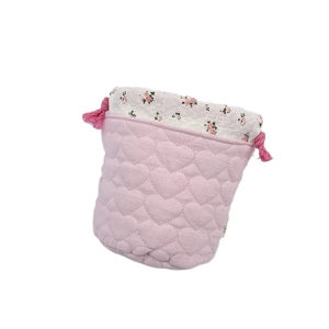 Pink heart quilted drawstring storage bag with floral lining for cosmetics and jewelry