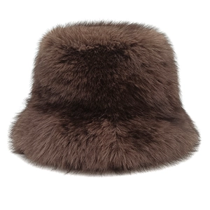 Detailed close-up of dark brown plush faux fur texture on a warm winter bucket hat