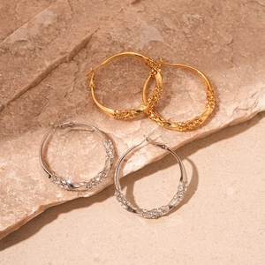 Twisted geometric hoop earrings with diamonds in gold and silver finish for women