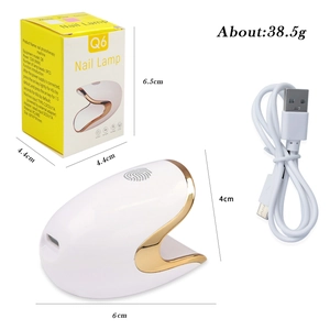 Portable 12W dinosaur egg nail lamp in white with gold trim, Type-C cable and packaging