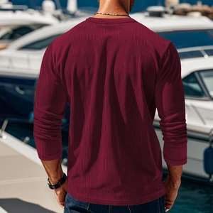 Rear view of men's burgundy long sleeve T-shirt with ribbed knit texture on a yacht pier