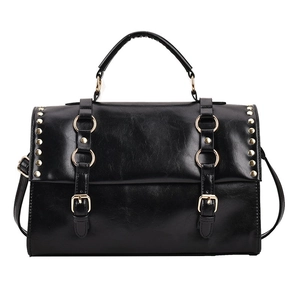 Vintage black faux leather satchel bag with metallic studs and decorative buckles