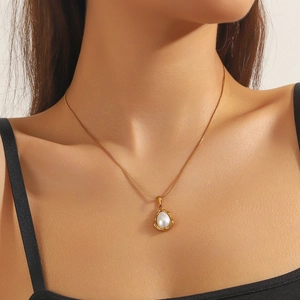 Gold-plated stainless steel necklace featuring a waterdrop pearl pendant on a model