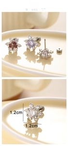 Macro view of snowflake screw-back earrings with 1.2cm colorful zircon inlay detail