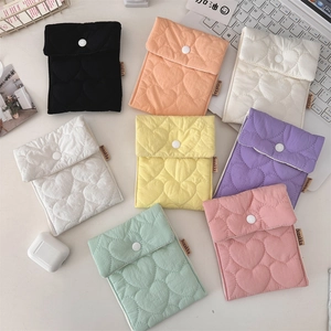 Detail of heart-quilted sanitary bags in various colors with secure snap closure