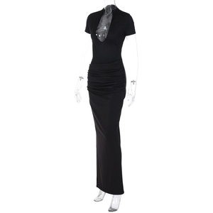 Detailed view of deep V-neckline and elegant waist ruching on this black maxi dress
