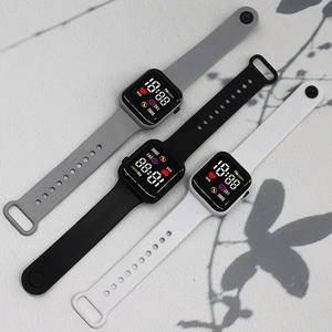 Three LED digital watches with grey black and white silicone bands showing fitness icons