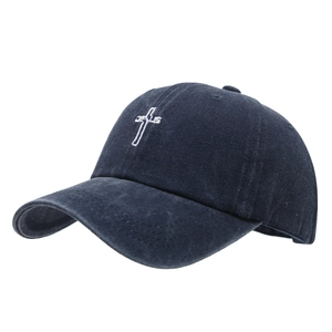 Vintage navy blue washed cotton baseball cap with white cross embroidery and curved brim