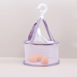 Detail of purple and white mesh drying basket for makeup sponges with hanging hook
