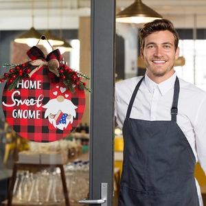 Round wooden Gnome door sign with buffalo plaid pattern and patriotic heart on glass door