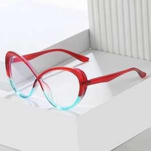 Detail of TR90 cat-eye glasses frame with red and blue gradient finish on white props