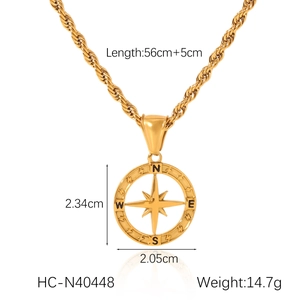 Close-up of golden compass pendant on twist chain with 56cm length and dimension details