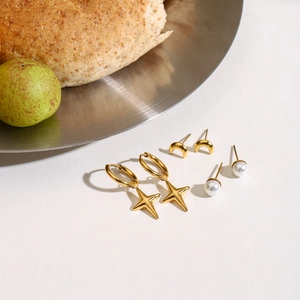 Golden stainless steel earring set with star hoops, crescent studs and pearls