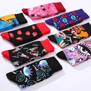 Pop art mid-calf socks with colorful lips and eyes pattern in a multi-pack display