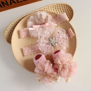 Pink lace baby headband and socks set featuring sparkling crown and starfish details