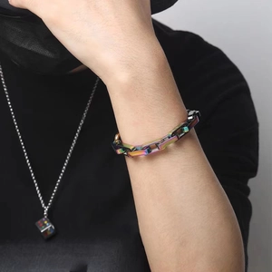 Detail of colorful rainbow titanium steel square link bracelet on male wrist