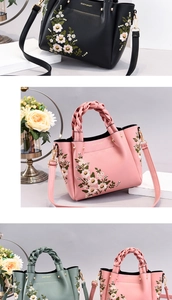 Detail of embroidered PU leather handbags with braided handles and golden hardware