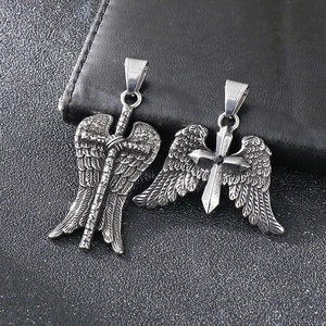 Detail of punk wings cross pendants with black zircon in silver stainless steel