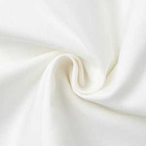 Macro detail of white twill fabric texture showing high-quality woven suit material