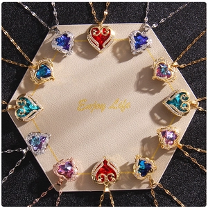 Macro shot of colorful heart-shaped crystal pendants on a leather display pad