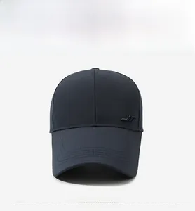 Detailed close-up of dark grey baseball cap with reinforced stitching and metal logo