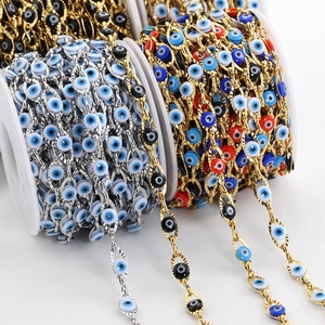 Golden and silver evil eye beaded chain on spools for DIY jewelry making