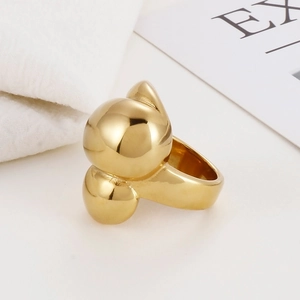 Detail of a modern gold spherical ring with a high-polish mirror finish on white background
