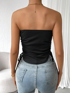 Close-up of black ribbed knit crop top back view with slim fit texture and fabric detail