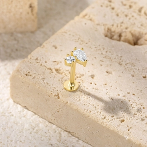 Detailed view of S925 silver gold butterfly stud earring with round and pear cut zircons