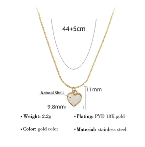 Detail showing 18K gold PVD plated stainless steel heart necklace with natural shell
