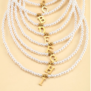 Elegant 26 initial letter pearl necklace set with gold pendants and minimalist charms