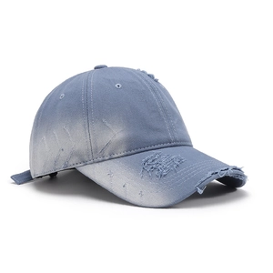 Distressed vintage light blue washed denim baseball cap with torn holes and adjustable strap