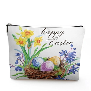 Close-up of linen cosmetic bag featuring watercolor Easter flowers and eggs design