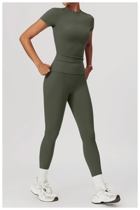 Detail view of quick-dry short sleeve yoga top and high waist leggings in olive green