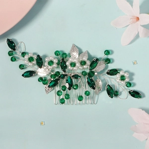 Elegant silver hair comb with green rhinestones and pearls for traditional bridal hairstyles