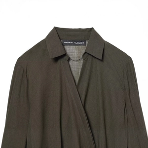 Deep olive green double-breasted blouse with long sleeves and twill fabric texture