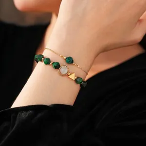Tiger eye and malachite layered bracelet set with gold geometric charms and beads
