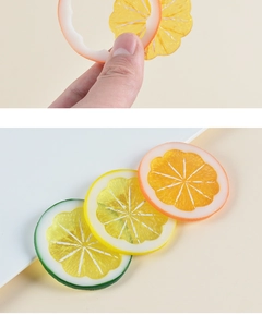 Detailed view of realistic PVC lemon slices showing translucent texture and fruit grain