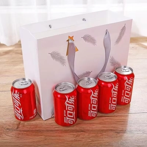 White feather gift bag with silver ribbon handles showing large storage capacity