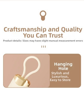 Close-up of lint roller hanging loop with elegant gold-tone sleeve and beige cord