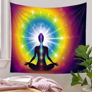 Detail of meditation yoga tapestry with seven chakras and mandala pattern on a white wall