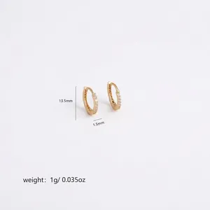 Detail shot of hollow small hoop earrings with cubic zirconia and lever back closure