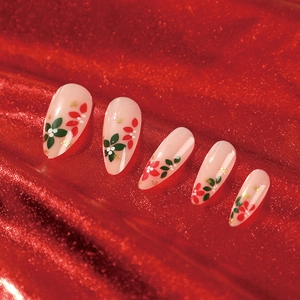 Christmas floral press-on nails with red and green flowers and gold foil on almond tips