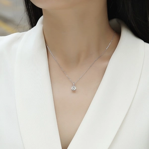 Minimalist S925 sterling silver necklace with a round solitaire pendant on a model