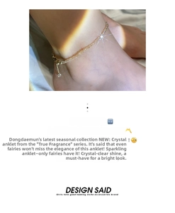 Detail shot of a minimalist gold anklet featuring sparkling crystal beads and lobster clasp