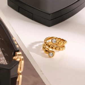 Bague spirale dorée en acier inoxydable avec deux zircons au design minimaliste